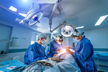 Neurourgeons are operating with medical robotic surgery machine. Modern automated medical device....