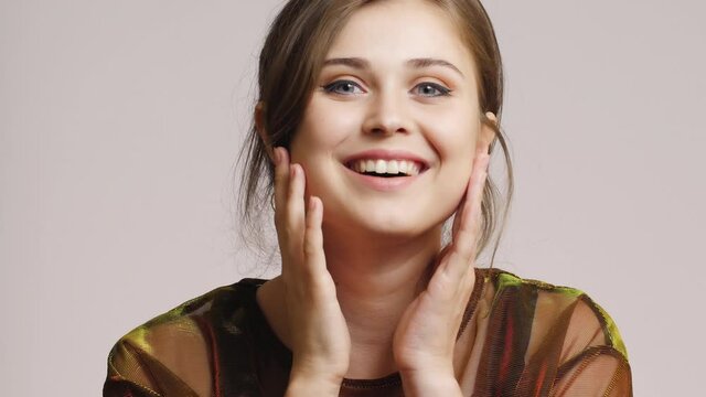beautiful girl on studio background, young woman photosession with make up, fashion model posing, beauty concept
