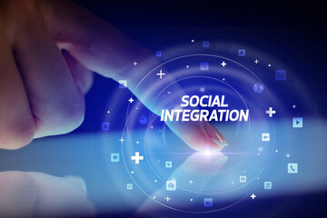 Finger touching tablet with social media icons and SOCIAL INTEGRATION