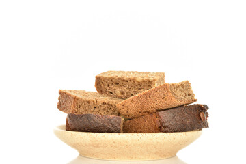 Slices of black cereal bread, close-up, on a white background.