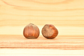 Hazelnuts, macro, on a background of natural wood.