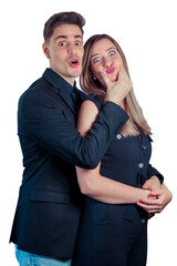 Young couple making funny faces and gestures on a white background