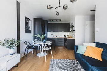 Foto op Plexiglas Living room with kitchen annexe in a modern studio apartment for rent © Photocreo Bednarek