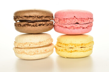 Tasty multi-colored, sweet macaroons, on a white background.
