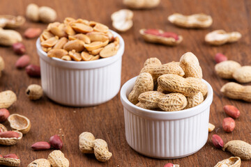 Dried peanuts on wood background