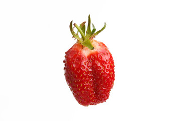 isolated close up detailed side view shot of a delicious vibrant red strawberry on a white background