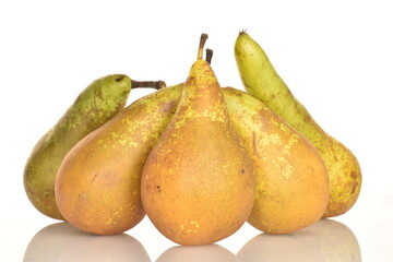 Ripe organic pears, close-up, on a white wooden table.