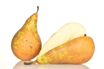Ripe organic pears, close-up, on a white wooden table.