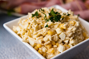 Bowl of vegetable salad of corn apples cellery and spices
