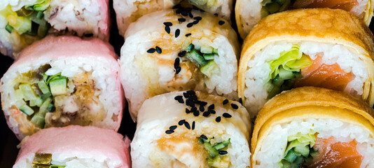 Sushi and roll set on wooden table. Selective focus