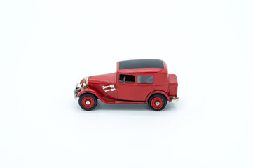 Children's toy Red fire truck close up on white background