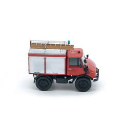 Children's toy red fire truck on a white background