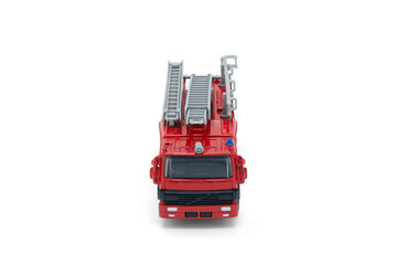 Children toy Red fire truck with a ladder on a white background