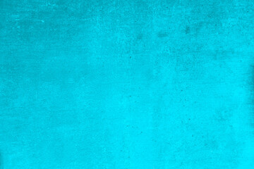 Detail of a grunge wall in a light blue tint