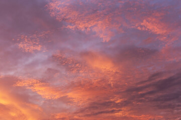 Naklejka na ściany i meble Epic dramatic sunrise, sunset pink violet orange sky with clouds background texture 