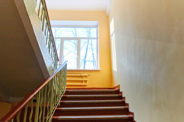 Close-up of the internal staircase in the old school. Empty stairs