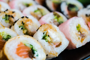 Sushi and roll set on wooden table. Selective focus