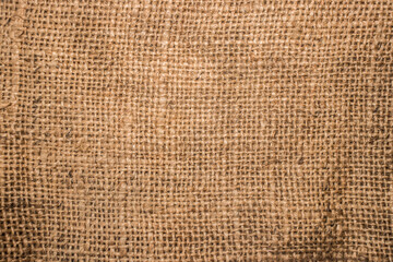 Rough canvas, burlap, sackcloth,сlose up.The canvas is made from various woven materials, such as...
