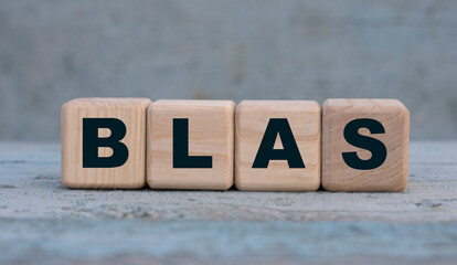 BLAS word on cubes on an old gray background .