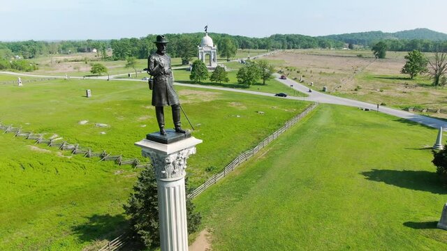 Aerial of army solider atop Vermont monument at Gettysburg National Civil War Battlefield, point of interest