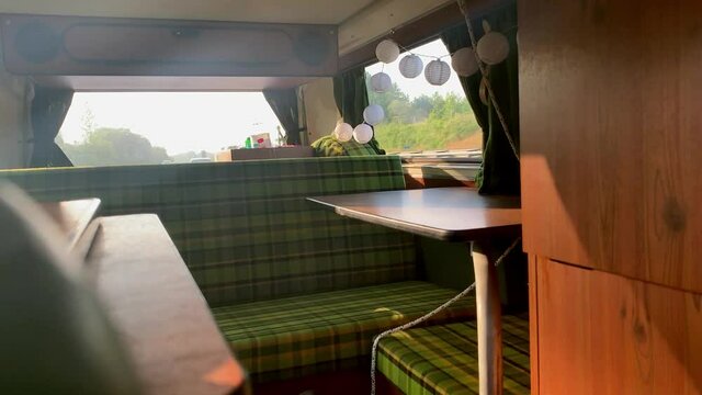 The back of an old campervan during a road trip.