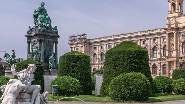 Empress Maria Theresia Monument timelapse and Art History Museum with fountain on foreground in Vienna, Austria. Beautiful view of famous Naturhistorisches Museum (Natural History Museum) with park