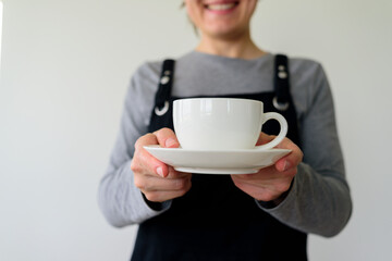 Woman waitress with cup smiling