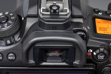 The back of digital camera with control buttons, view-finder and display, close up.