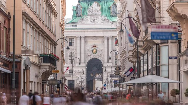 Kohlmarkt street with Hofburg Complex timelapse in downtown of Vienna in Austria with crowd in the street. Many caffes and shops around