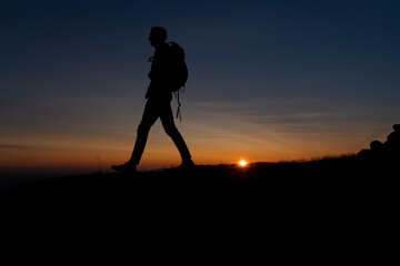 A silhouette in the midnight sun of Greenland