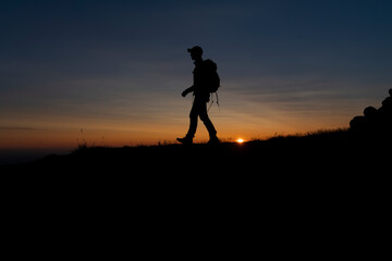 A silhouette in the midnight sun of Greenland