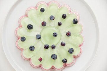 Jelly cake with blueberries. Striped and sweet dessert.