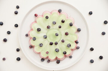 Jelly cake with blueberries. Striped and sweet dessert.