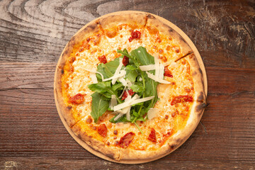 Basic Pizza, Pizza Razzo, Easy and fast to do and eat Razzo, Easy and fast to do and eat. Ready to serve over a wooden table. Top view