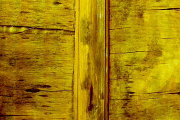 Yellow wooden surface with cracks. Wood texture.