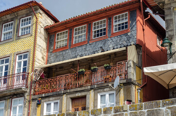 Historic old city buildings facades and with clean laundry on balconies, Porto, Portugal