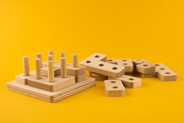 Children's wooden toy sorter. Educational logic toys for kid's close-up. Montessori Games for child development
