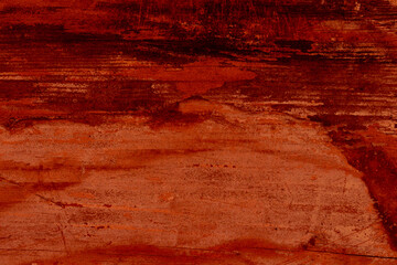 Fototapeta na wymiar Texture of red-orange old wooden surface with space for text.