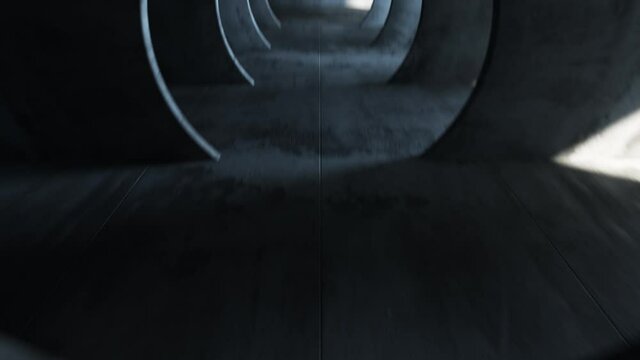 Endless flight in a gray concrete tunnel. The movement of the camera in a circle. Solar swap makes its way from different sides. Seamless loop abstract animation