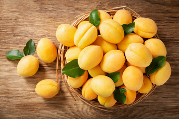 fresh ripe apricots on a wooden table