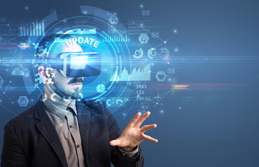 Businessman looking through Virtual Reality glasses with UPDATE inscription, innovative technology concept