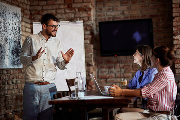 freelancers having casual business meeting in cafe.