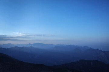 Mountain peaks in fog scenery landscape