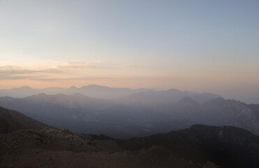 Fototapeta na wymiar Mountain peaks in fog scenery landscape
