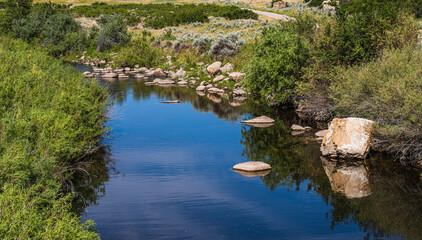 Fototapeta na wymiar reflections on a creek