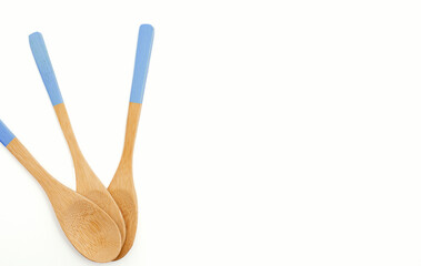 Wooden spoons on white background