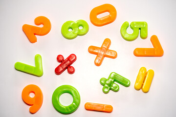 colorful plastic numbers on a white background