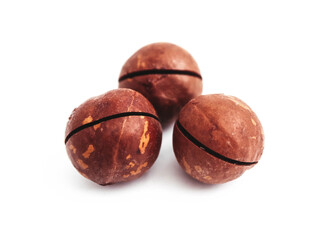 Macadamia nut with a cut on a shell, isolated on white background.
