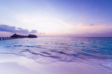 Sunset in the Maldives. Luxury resort villas water bungalows - 360482094