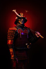 Portrait of a samurai in red armor in profile, his katana on his shoulder